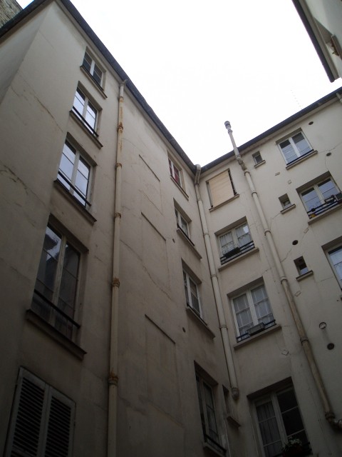 April 2006 Paris Apt07 courtyard view of my bedroom 1 floor from top middle of picture.jpg