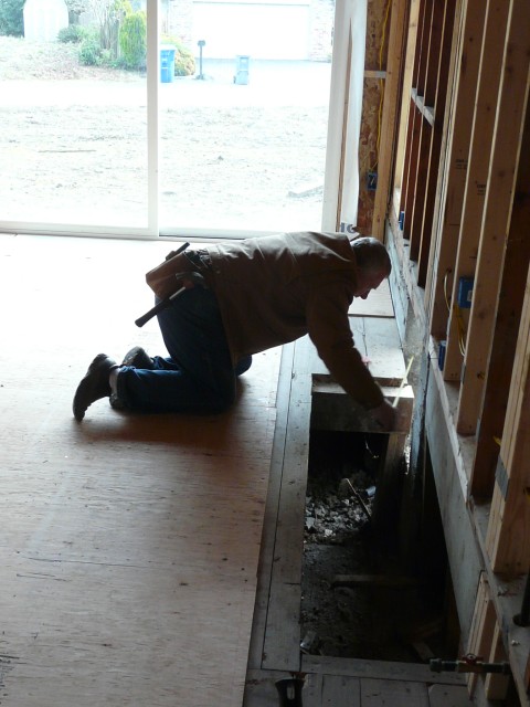 2009 Dec Bellevue Jason's House 05 fixing hole.JPG