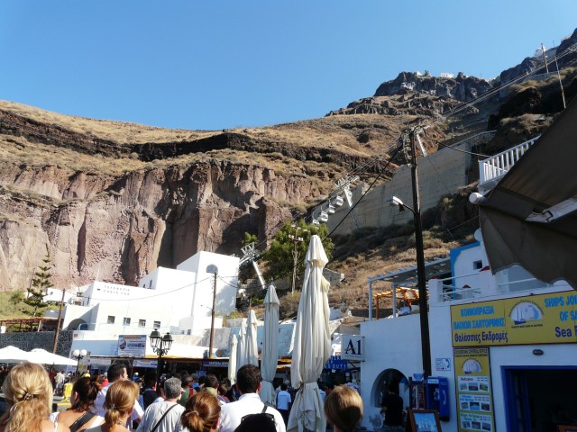 09Aug20 Santorini 07 Margo & I waiting in line for cable car.JPG