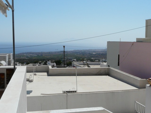09Aug20 Santorini 08 view through bldgs to other side of island.JPG