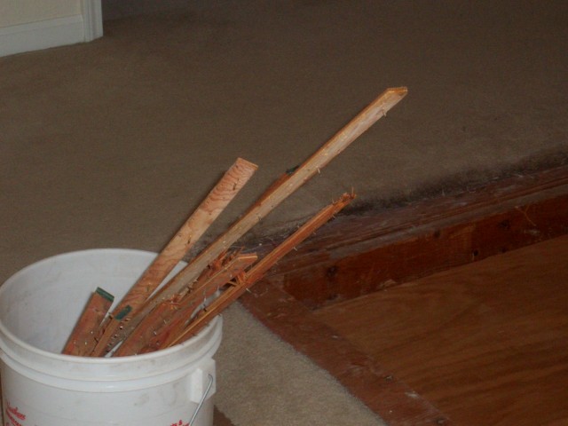 2005 August 29 Conversation Pit Day 2 Installation 01 removing carpet strip.jpg