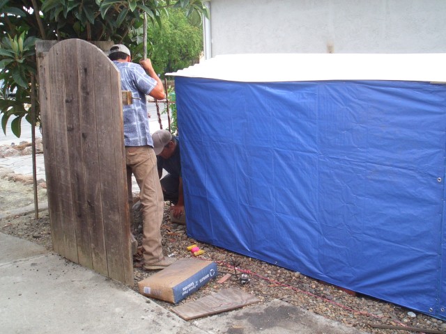 2005 Sep 12 fence 07 demolition complete new tarp on wood pile.jpg