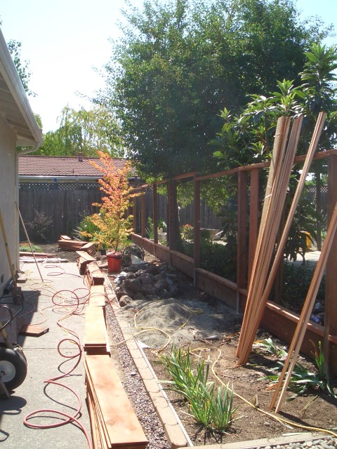 2005 Sep 12 fence 35 wood piled & ready.jpg