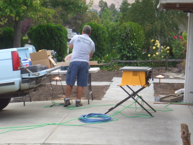2005 Sep 12 Conversation Pit Day 3 Installation 01 Larry cutting trim.jpg
