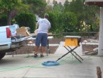 2005 Sep 12 Conversation Pit Day 3 Installation 01 Larry cutting trim.jpg