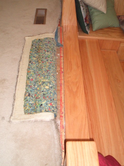 2005 Sep 19 Conversation Pit Day 4 Installation finish work 05 carpet tack strip.jpg