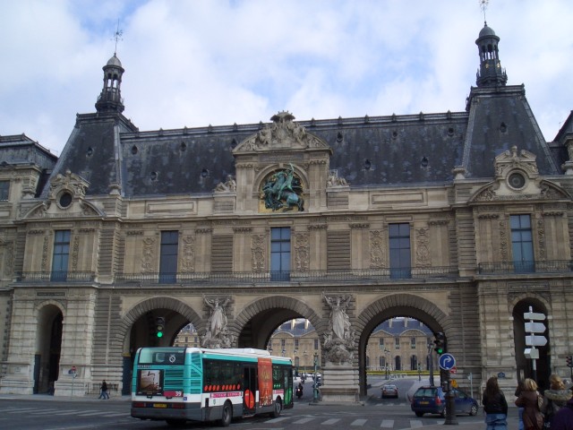 April 2006 Paris Day 4aa Louvre entrance by river.jpg