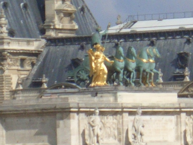 April 2006 Paris Day 4ai inside Louvre view of Arc de Triomphe du Carrousel figure of Victory.jpg